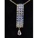 A 9ct yellow gold tanzanite pendant, suspended on 9ct yellow chain.