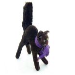 A 1930s Steiff black mohair Tom Cat, with arched back and upright tail, green and black glass