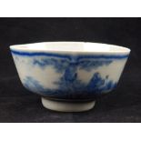 A Chinese rice bowl, blue and white glaze study of figures in a garden, bears four character mark to