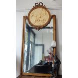 Turn of the century French gilded mirror, ribbon surmount, circular plaster plaque of cherubs,