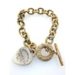 A Sterling silver Tiffany & Co. bracelet, suspended with a heart pendant inscribed 'If Found