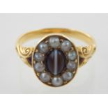 A yellow metal agate and pearl dress ring.