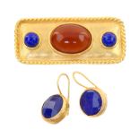 A costume jewellery plaque brooch, en suite with ear pendants, the rectangular gilded plaque set