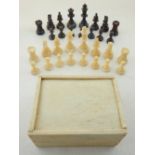 A 19th century bone box, with part chess set.