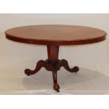 A Victorian walnut Loo table with oval tilt top on cabriole tripod. W. 137cm