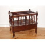 A Victorian rosewood Canterbury, with two division and turned supports above apron drawer, W 56cm.