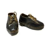 A pair of child's black leather clog style shoes, c.1900.