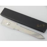 A contemporary Italian silver paper knife, with planished body, boxed.