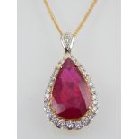 An 18ct yellow gold ruby and diamond pendant, the tear-drop shaped ruby of 7.11ct, diamonds of 0.