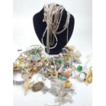 A large quantity of white metal chain necklaces, costume earring, brooches etc.