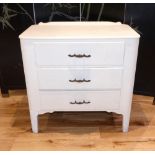 A small 1950s white painted three drawer chest. W. 76cm