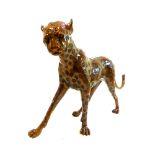 A life size patinated bronze of a standing Cheetah. L. 160cm