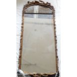 An early 19th carved gilt wood pier mirror, with a foliate frame and early double plate, H. 174cm