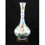 A Chinese doucai stem vase, multi-colour floral and bird decoration, H. 30cm, on wooden stand.