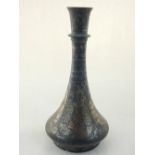 An Indo-Persian Bidriware vase, with typical floral decoration. H.