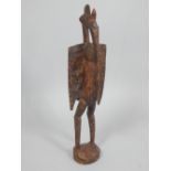 Ivory Coast wood carving of a birdlike deity. H 73 cm.