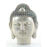 A Chinese white metal metal head of Guanyin.