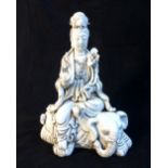 Blanc de chine figure of Guanyin seated on an elephant, bears seal mark to reverse. H.