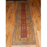 A Turkish Milas runner, polychrome decorated geometric design, fringed,