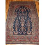 Persian Isfahan rug, the centre with floral shaped and blue ground medallion, within floral border,