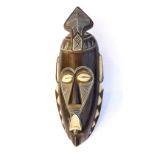 Carved and painted West African wall mask, faux cowry shell eyes, approx.