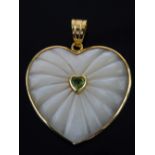 Heart pendant, carved mother-of-pearl with heart carved peridot to centre,