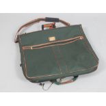 Harrods retailed leather and green canvas suit / travel case.