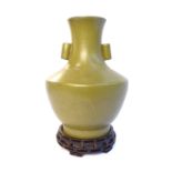 Green glazed Chinese baluster vase, twin cylindrical handles, bears seal mark to base,
