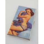 A cigarette case, with printed image of a pin-up girl. L.