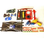 Quantity of vintage Scalextric, six cars, controllers tack and accessories.