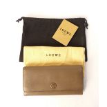 A Loewe grey ladies leather purse, gilt metal details,