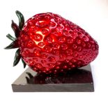 Contemporary composition red / green gloss ornament modelled as a giant strawberry, L.