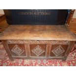 18th century design oak coffer, with lozenge carved triple panel front, on stile feet. W.