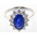 18ct white gold, sapphire and diamond dress ring, the central oval faceted stone approx.