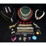 Costume jewellery including a Mexico silver owl, silver toboggan brooch, peacock brooch etc.