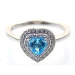 9ct white gold, blue topaz and diamond heart shape ring.