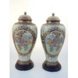 Pair of satsuma urn and covers, cream and gilt with cartouches of noblemen in landscapes,