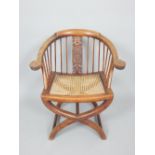 Colonial horseshoe chair, carved splat, water carving to arms, rattan seat,