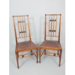 In the manner of Gustav Stickley, a pair of Austrian Secessionist chairs, mahogany,