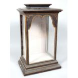 A George III style painted and gilded table top display cabinet, with pagoda style top and shaped