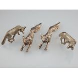 Pair of small silver knife rests, London 1988, modelled in the form of foxes, and a pair of