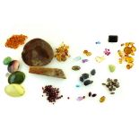 A large quantity of loose gemstones including a star sapphire, yellow sapphires, topaz, citrine,