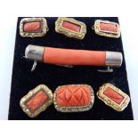 Branch coral brooch and six other 'framed' coral brooches (7)