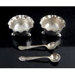 Pair of hallmarked silver salts and spoons in presentation box,