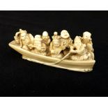 Large antique carved ivory netsuke group of Chinese musicians in a boat, signed to base in red seal,