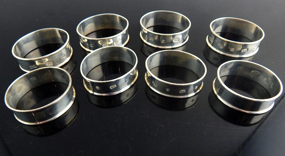 Matching set of eight oval silver napkin rings, c.