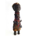 Antique carved wooden tribal fetish figure with bead,