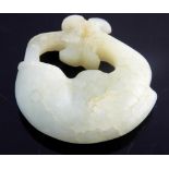 Chinese light jade circular pendant carved in the form of a fish following its tail