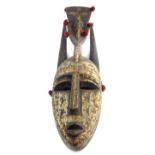 Unusual antique Bambara metal clad wooden horned tribal face mask, in the Sega sub style, Senegal,