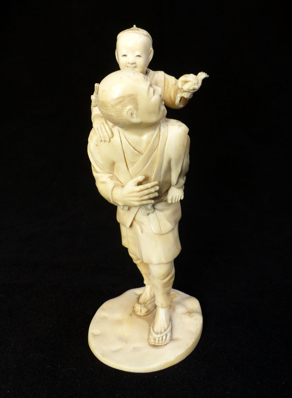 Late 19th C Japanese carved ivory group of a fisherman carrying his son who is holding a crab, - Image 3 of 5